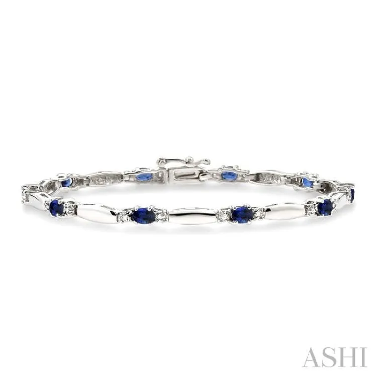 1/10 Ctw Bar and Oval Mount Round Cut Diamond & 5x3 MM Oval Cut Sapphire Precious Bracelet in 10K White Gold