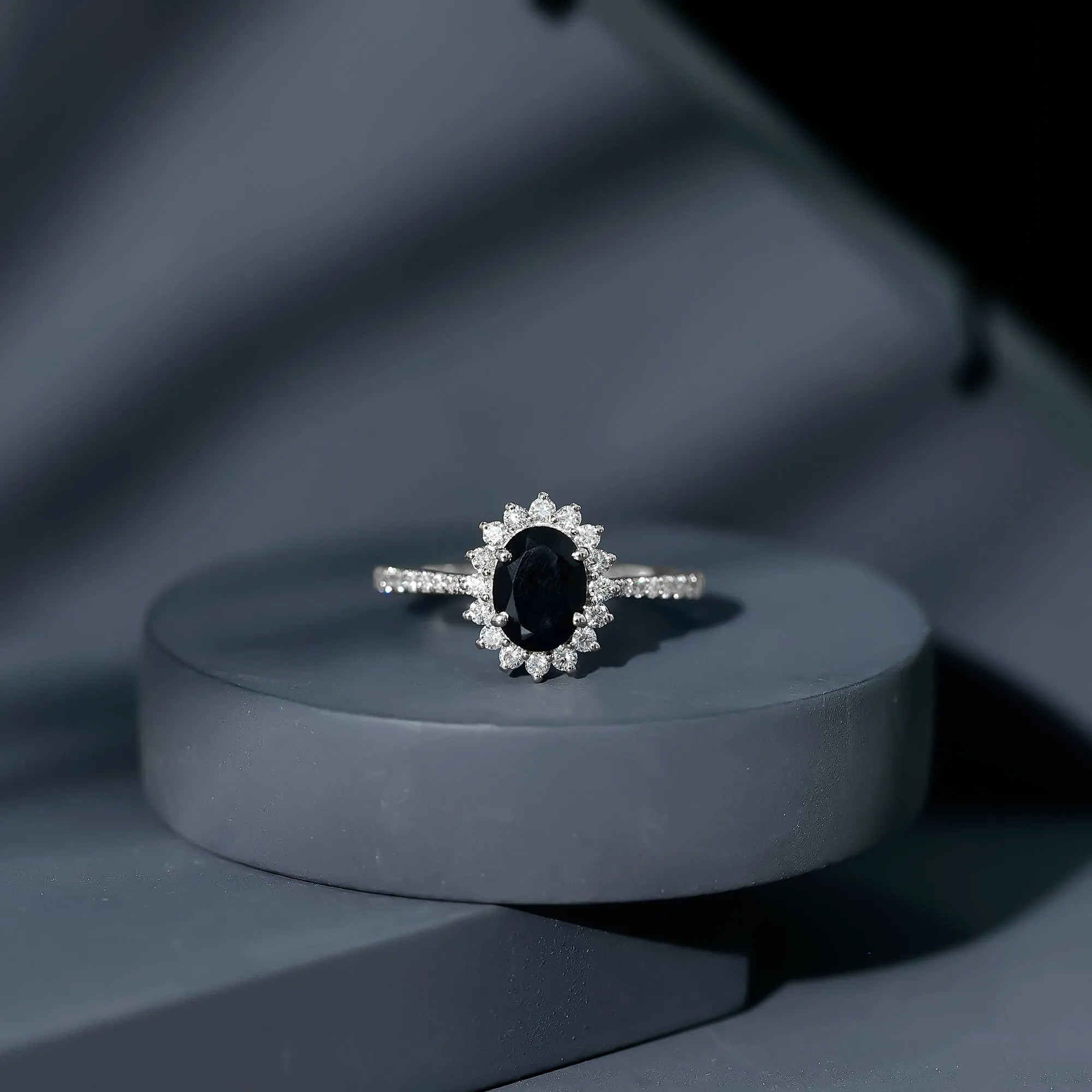 Oval Cut Lab Grown Black Diamond and Diamond Halo Engagement Ring